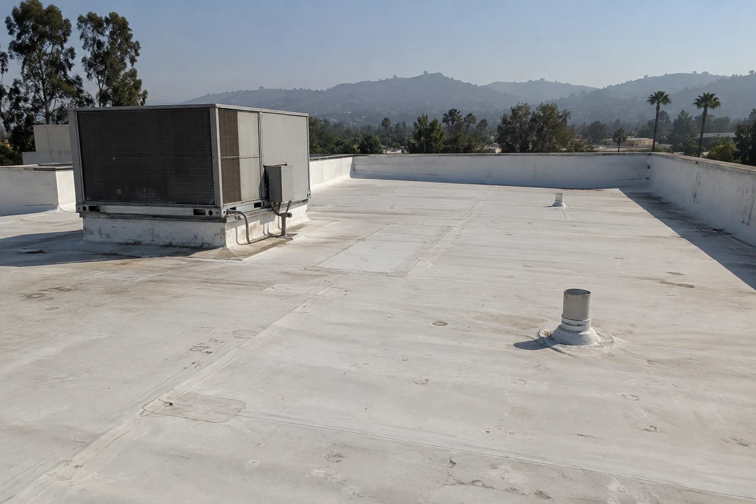 White TPO roof on a commercial building White TPO roof on a commercial building